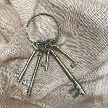 SOLD - Vintage Set of Five Brass Keys on Loop